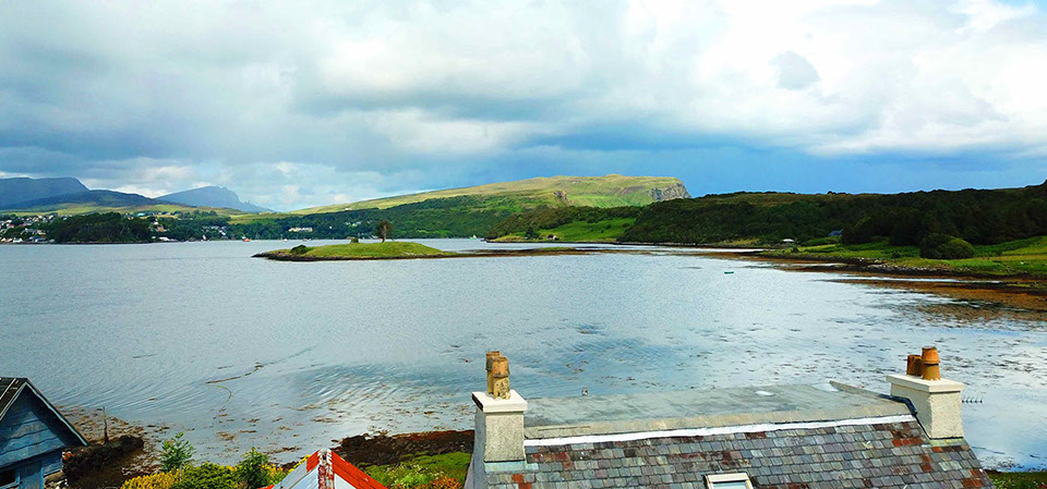 Our self catering cottage looks on to amazing sea views of Portree Bay at Caberfeidh Boat House