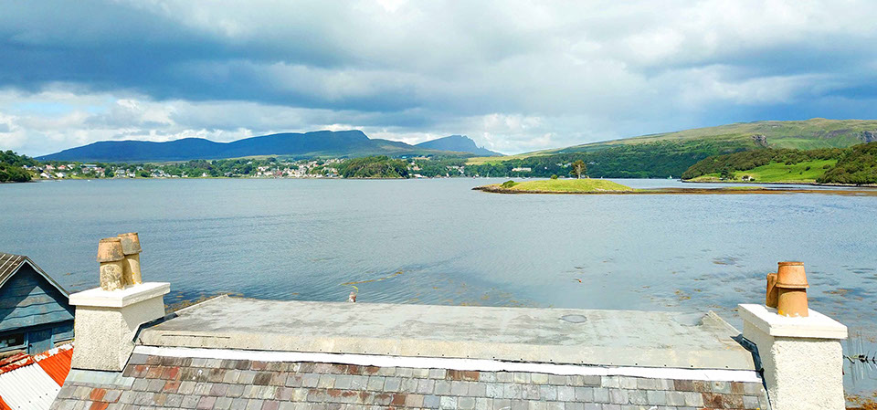 Caberfeidh Boat House is a sea view self catering accommodation cottage located near Portree with sea views of Loch Portree