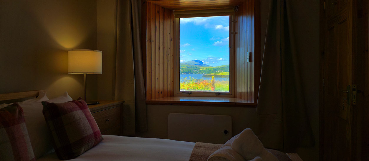 Wake up to sea views of Portree Bay when you stay at Caberfeidh Boat House self catering accommodation cottage near Portree