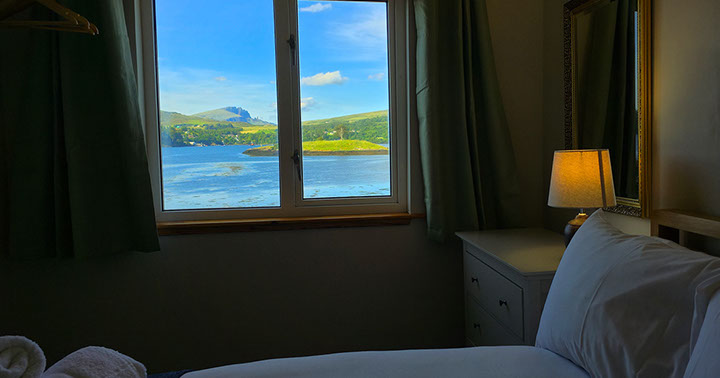 Caberfeidh Boat House contains sea view rooms looking on to amazing sea views of Loch Portree self catering accommodation